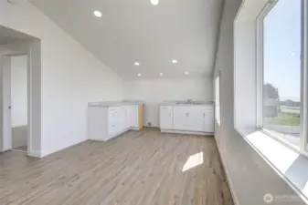 Upper great room with kitchen.