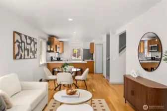 This open concept floor plan features hardwood floors, fresh paint and a kitchen island.