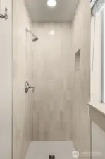 Main level bathroom was beautifully remodeled in 2025 with new ceramic tile and updated plumbing.