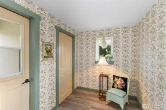 Mudroom with walk-in pantry and backdoor to open deck and views of the property.