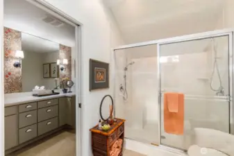 Double sink in the primary with shared shower - private with pocket doors on either side.