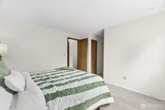 Primary bedroom with new carpet. This spacious room features comfortable, recently installed carpeting, perfect for relaxation and rest.