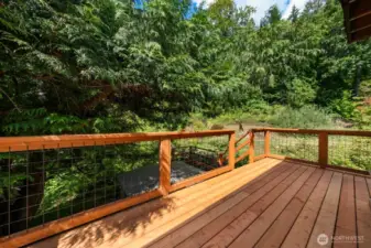 Lower deck leads to hot tub by the waterfall.
