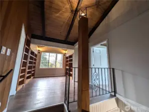 Study/office/library?  Cool vaulted area w/built-ins.