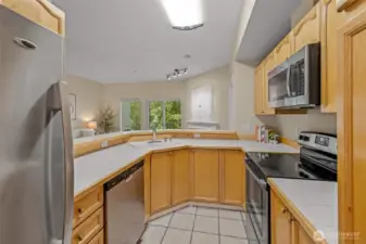 Inviting open Kitchen with Stainless Steel appliances.