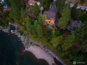 Welcome to 9690 East Leavenworth Road Low-bank Wenatchee River frontage with a natural shoreline, offering a rare and private waterfront setting surrounded by mature evergreens.