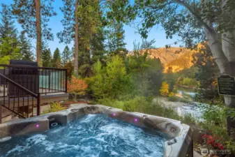 Private hot tub setting with mountain views—perfect for unwinding while taking in the natural beauty of the surrounding landscape.