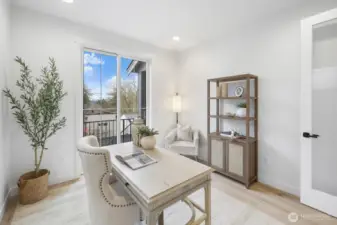 Bright and thoughtfully positioned, the main-floor den offers a refined work-from-home setting with flexibility for study, reading, or quiet retreat.