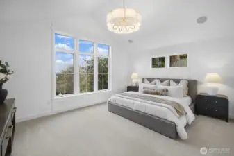 The primary suite feels calm and expansive, with abundant natural light and a serene atmosphere that elevates everyday living.