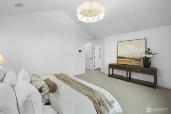 Spacious and inviting, the primary suite offers a peaceful escape with elevated scale, soft light, and a restful setting above the street.