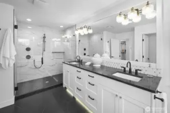 Spa-inspired and beautifully scaled, the primary bath pairs a generous dual vanity with a large walk-in shower for a polished, retreat-like feel.