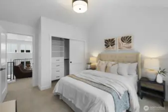 Bright and comfortable, this upper-level bedroom offers generous proportions, soft natural light, and easy access to the surrounding hallway spaces.