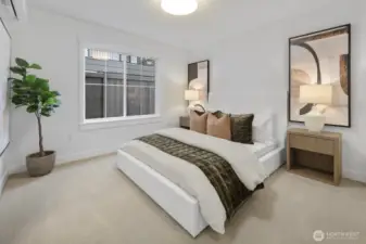 Bright and inviting, the lower-level bedroom offers a comfortable private retreat for guests, extended stays, or flexible everyday use.