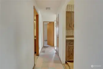 From Entry, turn right and head toward the Lake. Kitchen is off to the Right. Main Bath on Left and Large Primary Bedroom is straight ahead! Needs New Floors!