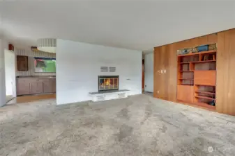 Brick Faced Wood-Burning Fireplace (fire is image) and Custom 1950's Built Ins!
