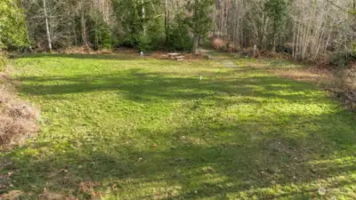 Here's a partial view of the building site on this 10 acre parcel in Longbranch. Well, power, septic is in and ready for you to build your new home! Or bring in a manufactured home or RV while you work on your plans and securing a builder. You can do a land loan here with utilities on site.