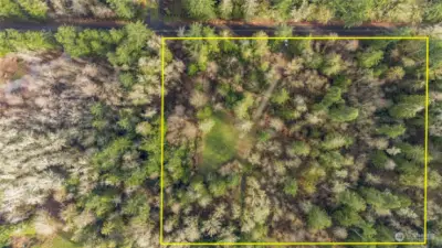 Here's an aerial view of approximate property lines. The road is at the top and you can see there's no one too close to you. The drainfield's for the two separate homes are locate don the other side of the wetlands, on the bottom of this photo above.