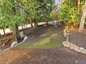 Beautiful, leveled and stone-encircled space for a garage, building or lawn.