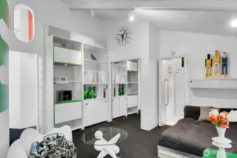 Primary bedroom suite on the main floor with shower and built ins for storage and decorations.