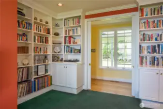 Plenty of space for albums and books in the den. Pocket doors can make it very private.
