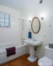 Main floor full bathroom is adjacent to the bedroom and right off the entry hall.