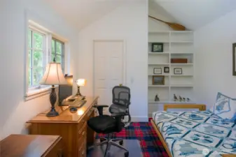 Small office/extra bedroom with built-in bookcase and walk-in closet.