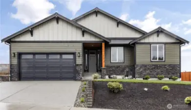 Photo of a similar home in the neighborhood by the same builder
