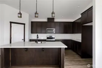 Photo of a similar home in the neighborhood by the same builder