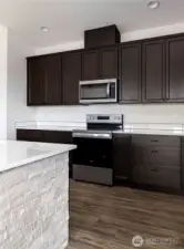 Photo of a similar home in the neighborhood by the same builder