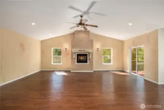 Cozy gas fireplace and hardwood floors are elegant and timeless.