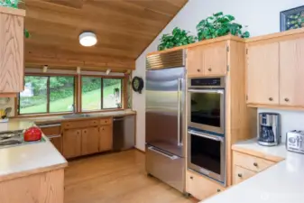 Very ample kitchen with walk in pantry just past the Sub Zero refrigerator.