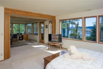 Primary bedroom can be separated from the office with acordian folding doors. Glass door goes to hot tub room.