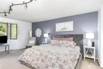Upstairs primary bedroom with bay window