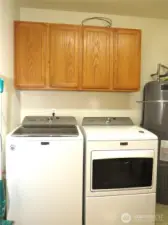 OFF THE GORMET KITCHEN IS LAUNDRY ROOM WITH STORAGE AND DEEP SOAKING TUB!