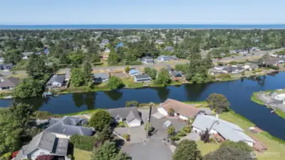UP AND AWAY WITH VIEW OF THE HOME AND THE OCEAN IN THE BACKGROUND!