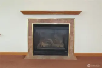 LIVING ROOM HAS A TILED PROPANE FIREPLACE FOR COOL BEACHY EVENINGS!