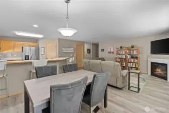 The adjacent dining area seamlessly flows into the living room, making it ideal for hosting dinner parties or enjoying weeknight meals.