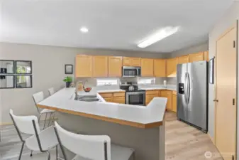 Highlights include stainless steel appliances, a center breakfast bar for casual meals, abundant counter space, and a pantry for all your storage needs.