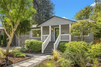 Inviting front entry with pavers leading to front steps & covered porch.