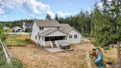 fenced back yard area , covered porch is great for year round entertaining
