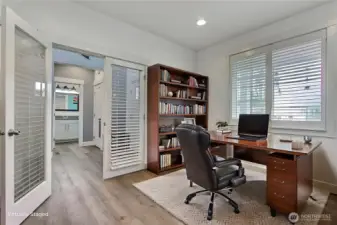 Main level office with French doors located at the front of the house