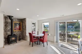 Family room with Wood Stove and access to Patio and Hot Tub