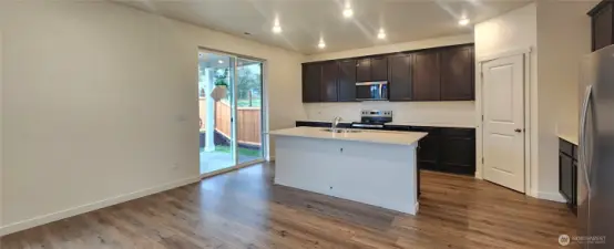 Kitchen opens to covered back patio.