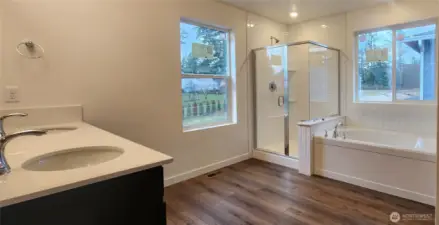 Ensuite Primary Bathroom with our optional "Super Primary" includes a soaking tub and subway tile surround in shower and tub. Dual sinks and quartz countertops included!