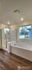LVP flooring in primary bathroom.