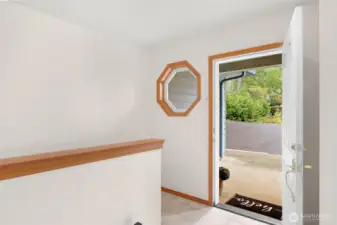 The foyer of this lakefront gem is a large space which opens to the main floor or provides access to the basement area.