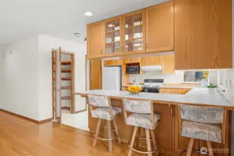 The kitchen has a convenient eat in bar area.