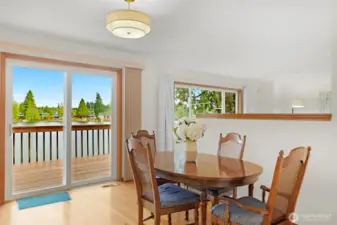 Views abound from each room on the main level.    The dining area also offers access to the deck overlooking the waterfront.