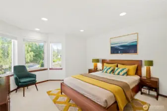 Virtually staged upstairs guest bedroom with traditional architectural details and recessed lighting.