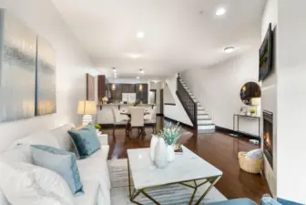 Open-concept layout connecting living, dining, and kitchen areas.